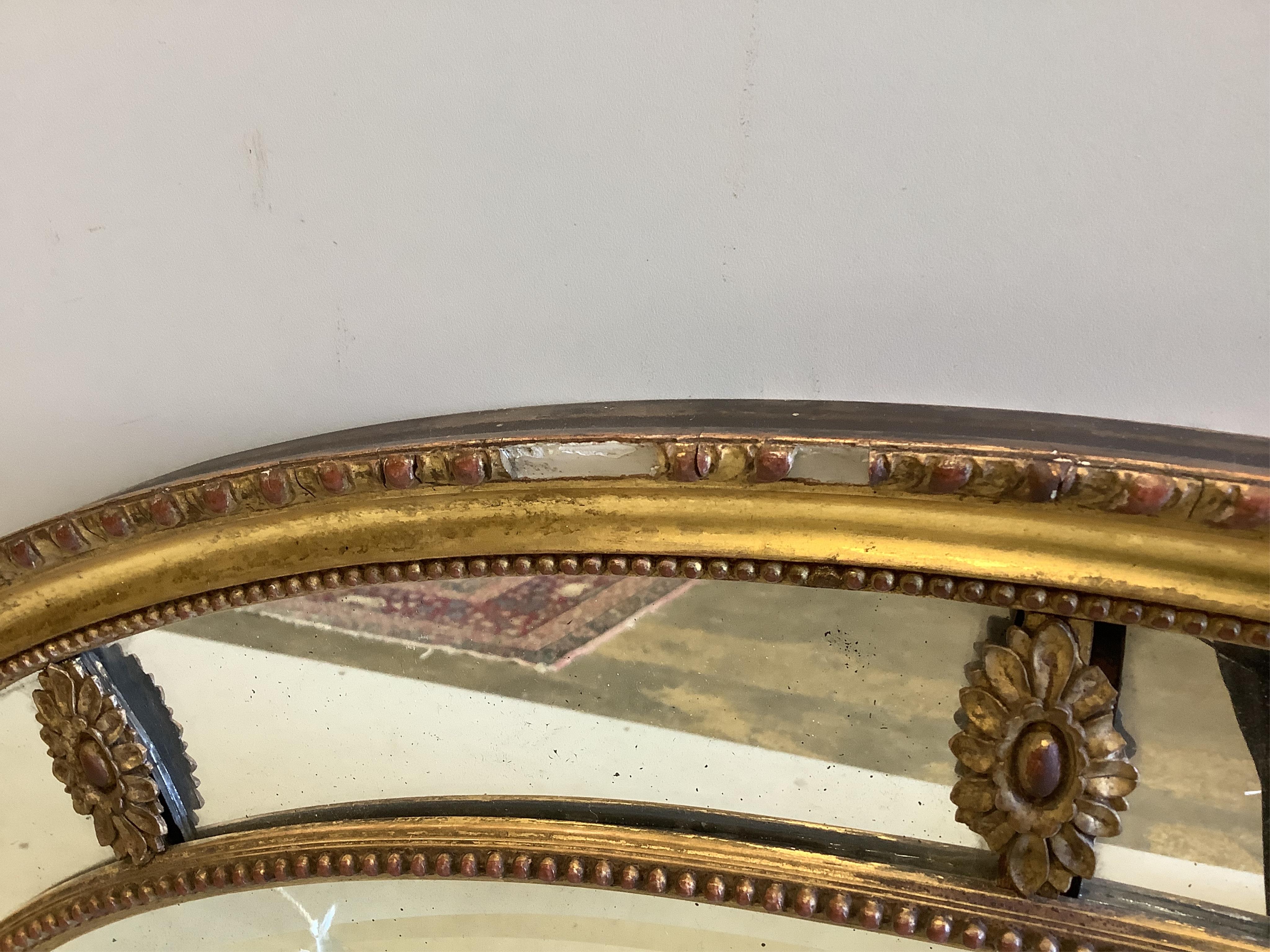 A Victorian Adam style oval giltwood and composition wall mirror with marginal plate, width 81cm, height 57cm